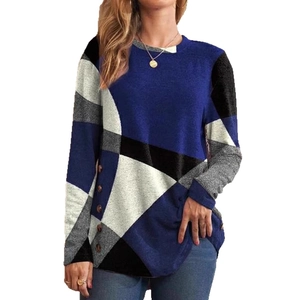 Women's long sleeve top with geometric color block pattern and side button details