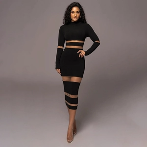 Close-up of mesh splicing and striped cut-out details on a slim-fit maxi dress