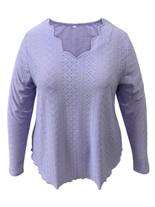 Detailed close-up of light purple textured jacquard top with scalloped V-neck design