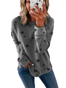 Women's loose grey long sleeve sweatshirt with black star patterns and ribbed cuffs