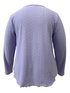 Close-up of lavender knit top featuring intricate hollow crochet and scalloped hem details