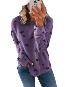 Purple long sleeve sweatshirt featuring a black star print and side slit hem detail