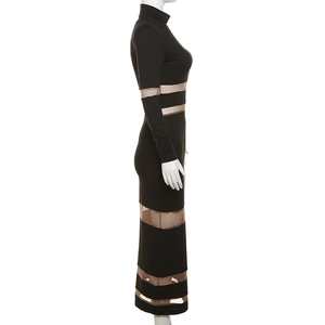 Detail of sheer mesh patchwork on a black high-neck bodycon maxi dress with side view