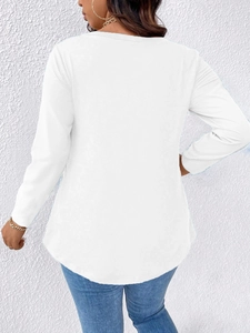 Rear view of white long sleeve top featuring a curved hem and soft knit fabric details
