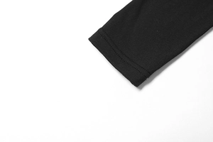 Detailed close-up of double-needle stitching on black mesh sleeve cuff for high-waist dress