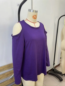 Detail of a purple cold-shoulder long sleeve top with a round neck in soft fabric