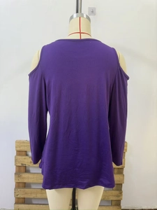 Close-up of purple cold-shoulder long sleeve top with smooth knit texture and casual loose fit