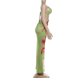 Detail of green floral two-piece set featuring a cropped bikini top and high-waist maxi skirt