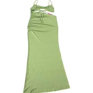 Detail of avocado green dress featuring spaghetti straps and side drawstring ruching