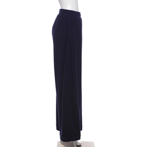 Detail view of high-waisted corduroy wide-leg pants in deep blue on a mannequin