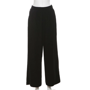 Detail view of high waisted black wide leg lounge pants with elastic waist and ribbed texture