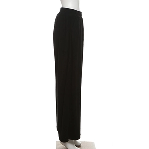 Detail view of high waist wide leg pants in black ribbed knit fabric with elastic waistband