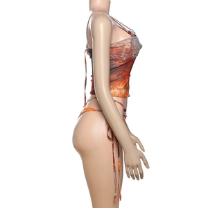 Detail view of orange mesh print bikini set with decorative beads on shoulder straps