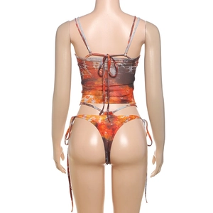 Detail view of the lace-up back design on the printed halter top and bikini set