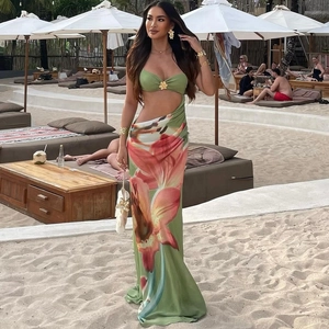 Floral print maxi dress with sage green halter neck and gold flower detail