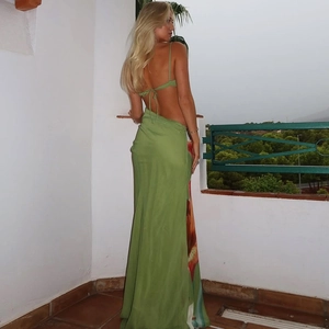 Green halter backless long dress with floral print for elegant summer vacation style