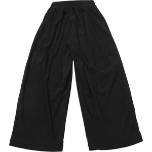 Detail of high waist elastic waistband on black pleated wide leg trousers for women