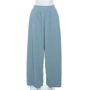 Detail of high waist elastic band on light blue corduroy wide leg casual trousers