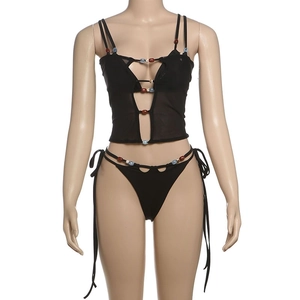 Close-up of black mesh bikini set featuring intricate colorful beadwork and cut-out details
