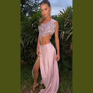 Detail of 3D floral applique and sequins on a lavender satin backless slit maxi dress