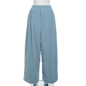 Detail view of high waist light blue corduroy trousers with back elastic waistband design