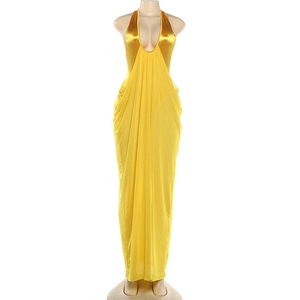 Detail of elegant yellow satin maxi dress with deep V-neck and ruched pleated texture