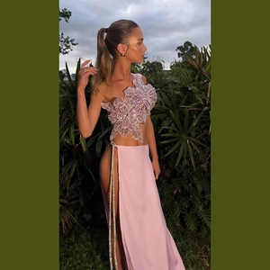 Detail of lavender sequin floral top and satin high-slit long skirt two-piece set