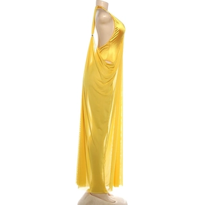Detail of yellow backless halter dress with shiny inner fabric and layered mesh overlay