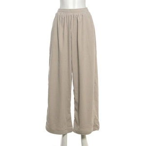 Close-up detail of high-waist elastic waistband on corduroy wide-leg trousers