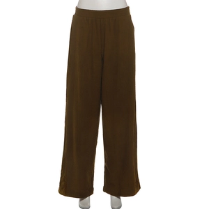 Detail view of brown corduroy wide leg pants with elastic waist and ribbed texture