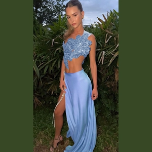 Detailed view of light blue sequin floral embroidery and silk high slit maxi skirt set