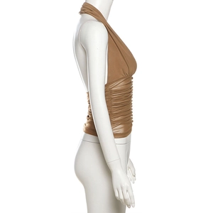 Detail view of the tan ruched halter top with side buttons and mesh pleats