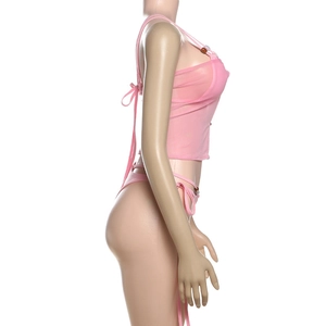 Detail of pink mesh bikini with side ties and decorative brown bead embellishments