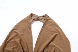 Macro detail of brown halter V-neck mesh pleated top with delicate seam stitching