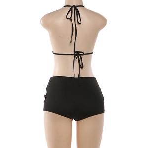 Rear view of black halter bikini with crisscross straps and side metal ring details