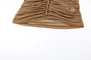 Detail view of khaki mesh fabric with elegant ruching and matching covered buttons