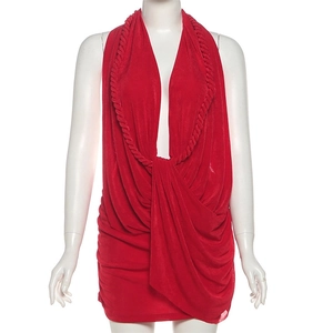 Detail of the plunging V-neckline with decorative rope trim on red halter dress