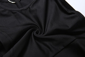 Detail of black knitted fabric with metallic silver ring neck fastener and pleats