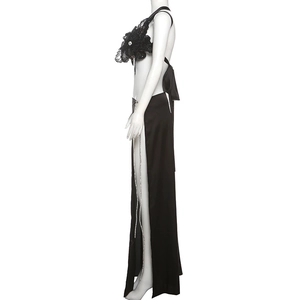Detail of black lace halter top with 3D floral petals and side slit maxi skirt set