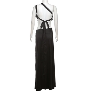 Detail view of black satin one-shoulder maxi dress with cutout back and waist bow tie