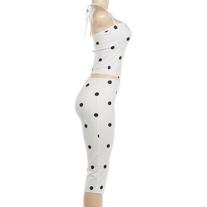 Detail view of polka dot halter top and high waist leggings set with slim fit cut