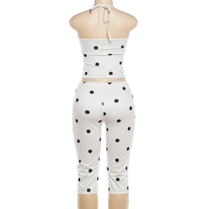 Rear view of polka dot halter crop top and high waist leggings set on a mannequin