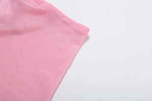 Close-up of pink mesh fabric detailing mesh weave and stitching on the bikini set