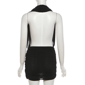 Detailed back view of a black halter mini dress with ruched fabric and backless design