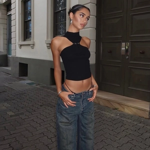Close-up of black halter top featuring high neck and silver metal ring buckle detail