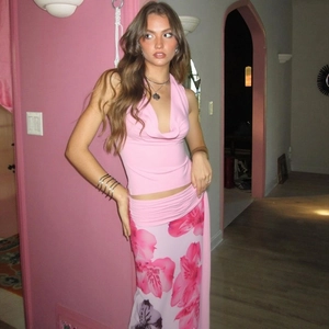 Detail of pink halter top and floral print maxi skirt in a stylish 3-piece summer set