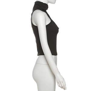 Detail of black mock neck sleeveless crop top with high-quality knitted fabric texture