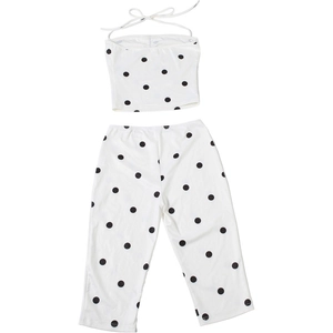 Flat lay of polka dot two-piece set featuring a bandeau top and wide-leg pants