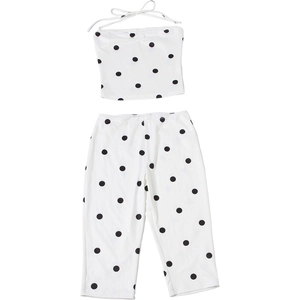Detailed view of polka dot halter top and cropped pants set on a white background