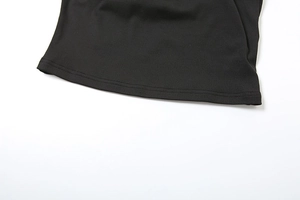 Close-up of the black ribbed knit fabric and high-quality double-needle hem stitching